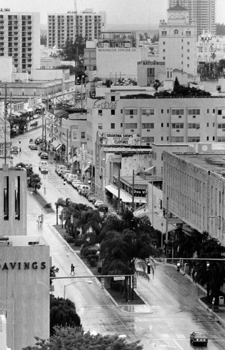 Drivers navigate the rain-soaked streets of Miami, date unknown. 